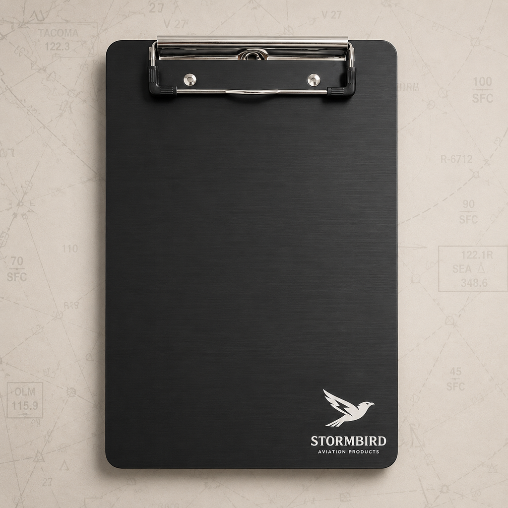 Black clipboard with Stormbird logo on a textured beige background