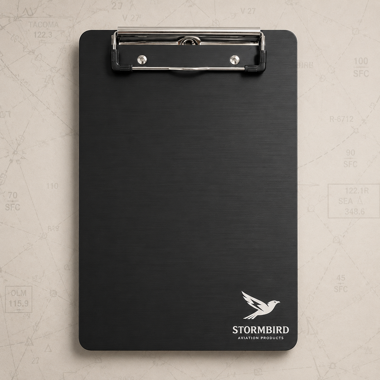 Black clipboard with Stormbird logo on a textured beige background